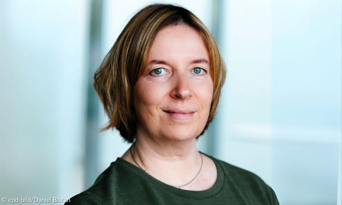 Eine Frau, sie lächelt